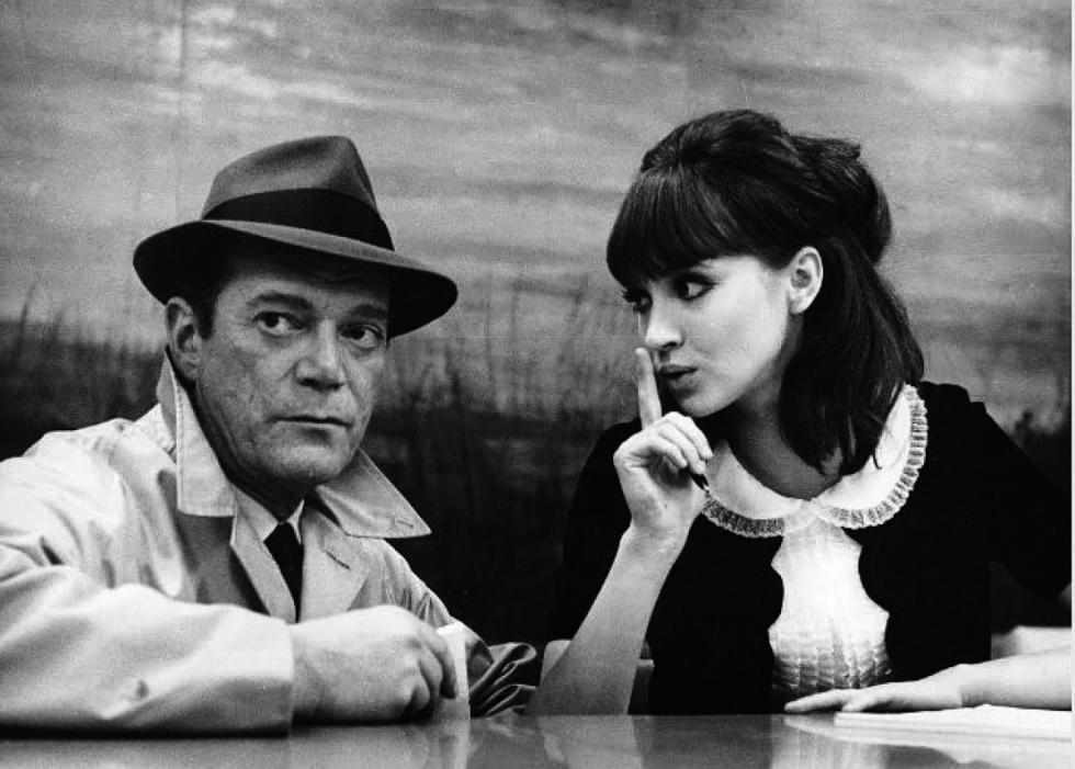 Film still of Eddie Constantine, left, and Anna Karina in a scene from the 1965 movie, 'Alphaville,' directed by Jean-Luc Godard. Credit: Georges Pierre/Pathe Contemporary Films - 
