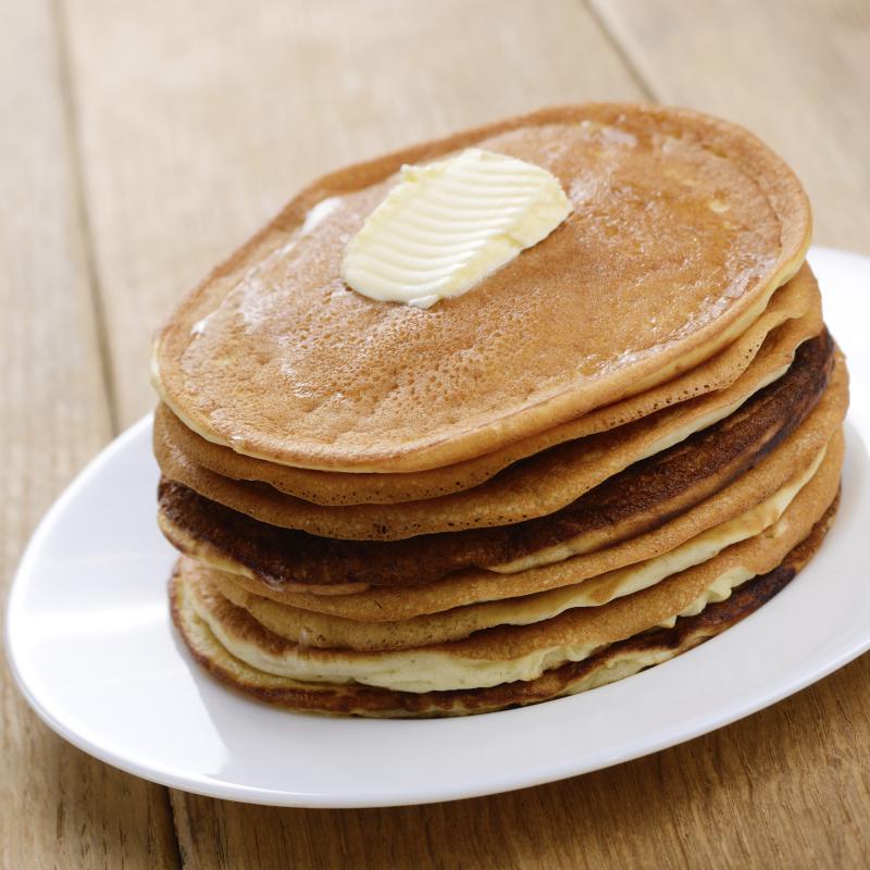 White plate with pankakes stack on the wooden table - OlenaMykhaylova | iStockphoto