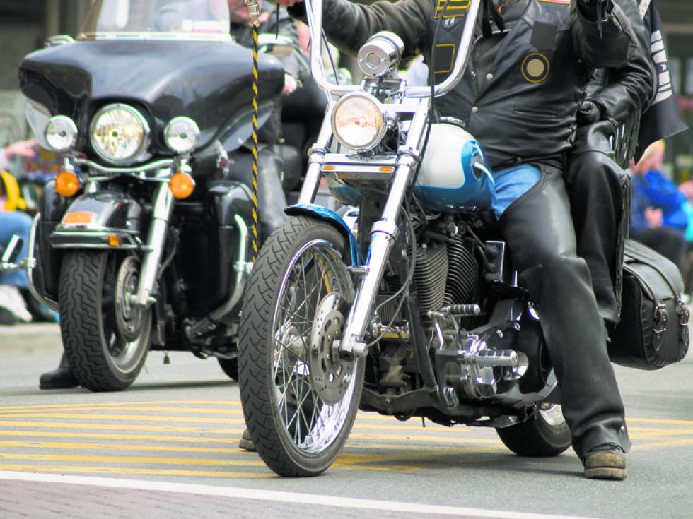 A close up on motorcycles  in a parade. - Travis Manley |
