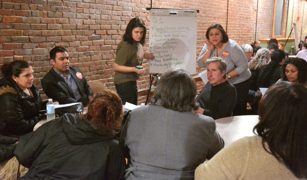 JERREY ROBERTS Marisol Rivera, by writing board at left, and Katherine Clarke, at right of the board, lead a group in discussion Thursday at Nueva Esperanza. - JERREY ROBERTS | DAILY HAMPSHIRE GAZETTE
