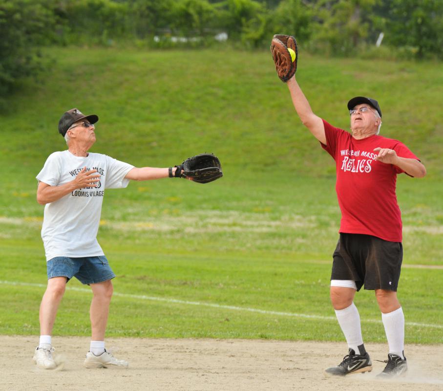JERREY ROBERTS Tom Lucia, right, catches a hit beside Vic Tidlund. - JERREY ROBERTS | DAILY HAMPSHIRE GAZETTE
