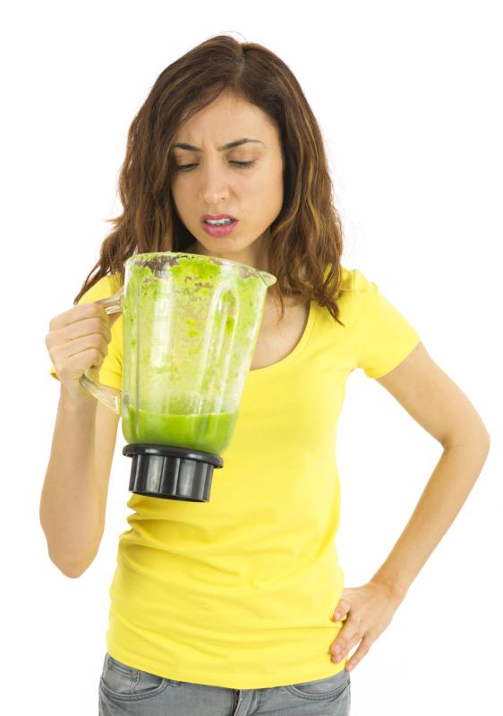 Woman unhappy about the green smoothie - DenizA | iStockphoto