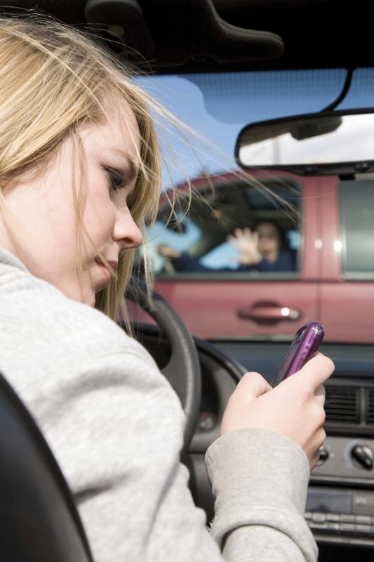 Girl texting accident - alanpoulson | iStockphoto
