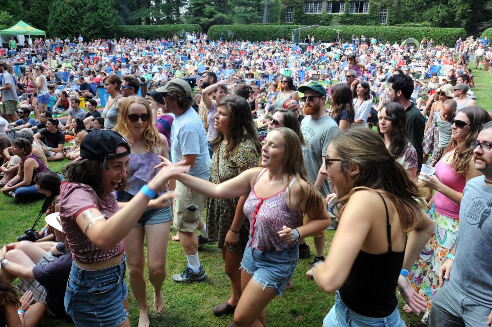 KEVIN GUTTING Dancers near the stage of the Pines Theater enjoy a set by And The Kids during the sold-out Amourasaurus concert at Look Park in Northampton on Sunday. - KEVIN GUTTING | DAILY HAMPSHIRE GAZETTE
