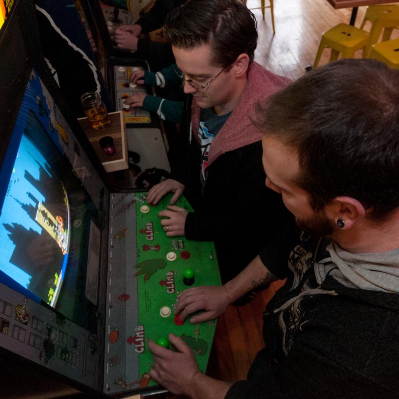 JASON PICARD Scott Goodhind (top) and Brandon Snow (bottom) of Greenfield, playing the classic arcade game, Rampage, at The Quarters in Hadley, Mass, on Saturday afternoon, Jan 25th. - Jason Picard |
