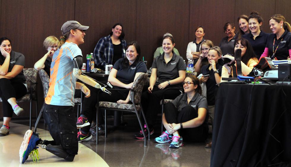 KEVIN GUTTING Athlete, actor and triple amputee Cameron Clapp of California demonstrates how he gets up after a fall during a motivational talk to health care workers at HealthSouth Rehabilitation Hospital of Western Massachusetts in Ludlow on Tuesday, October 6, 2015. - KEVIN GUTTING | DAILY HAMPSHIRE GAZETTE
