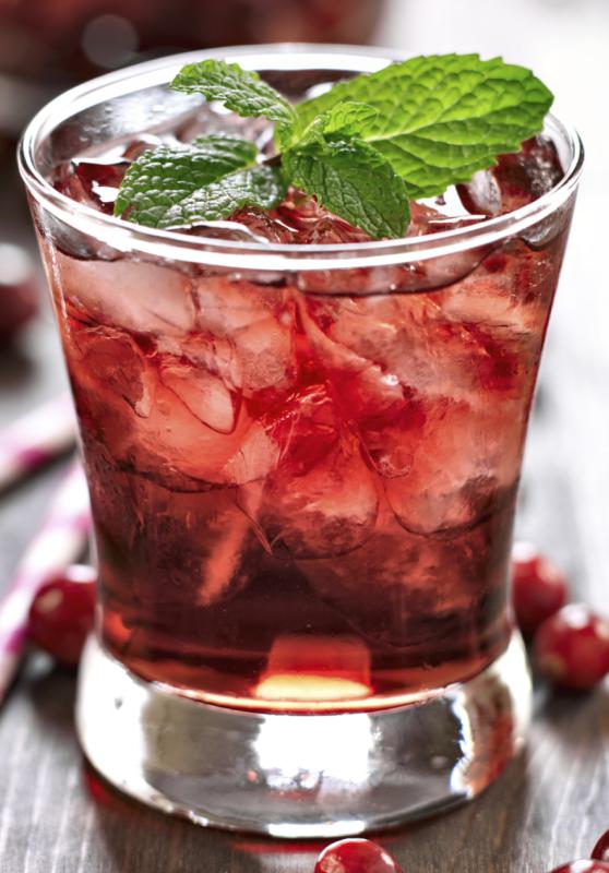 cranberry cocktail with mint garnish. - rez-art | iStockphoto
