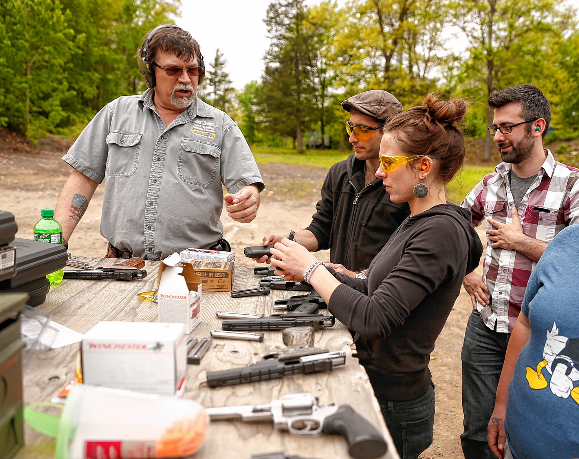 Kirk Whatley, left, instructs a group firearms training class Saturday at Norwottuck Fish and Game in Amherst.