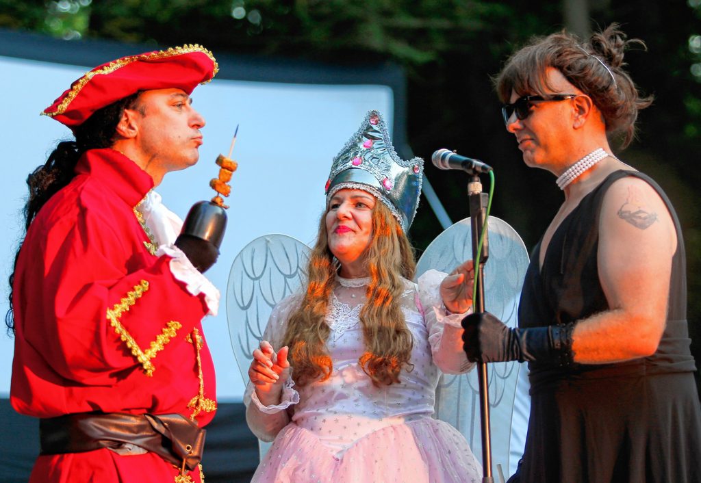 DAN LITTLE—GAZETTE FILE PHOTOSDAN LITTLE Joshua Braska, left, as Captain Hook, Joan Holliday, as Glinda the Good Witch, and Monte Belmonte as Audrey Hepburn, entertain the crowd in between performances during Transperformance 25- Look at the Movies,  Wednesday afternoon at Pines Theater in Florence.