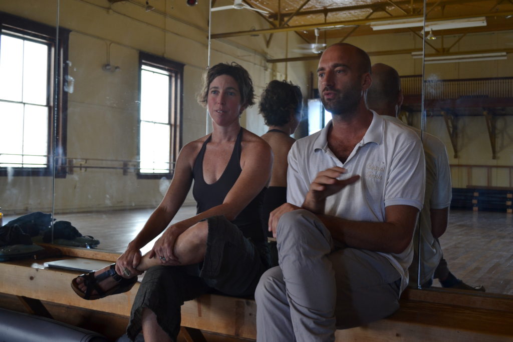 Jen Polins, founding artistic director of The School for Contemporary Dance and Thought, sits with collaborator Jake Meginsky. Hunter Styles Photo.