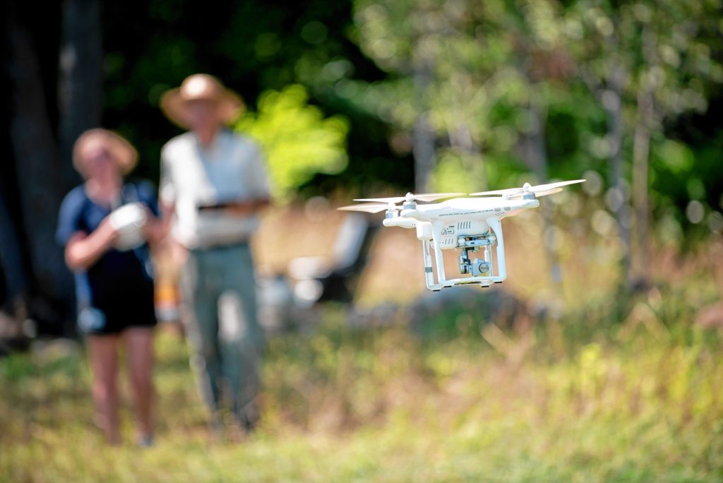 Gazette Staff/Andrew Whitaker—Andrew J. Whitaker/Gazette StaffLizzie Sturtevant and Paul Wetzel guide the drone back to ground control during the Spatial Analysis Lab flight demonstration at Smith College's Macleish Field Station Tuesday, August 9, in Whately.