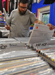 Andy Kivela of Easthampton looks through records at Electric Eye in Florence.