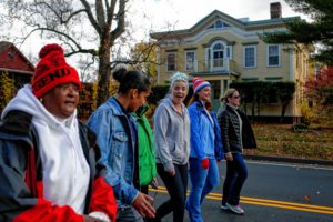 Joanne Price, left, peer support Netshari Ortiz, Mary Wilson, Page Policastro, and wellness director Stephanie Ovitt, all of whom live or work at Soldier On's transitional housing for female veterans on the Veterans Affairs campus in Leeds, walk in a Veteran's Day parade Nov. 10, 2016 in Northampton.