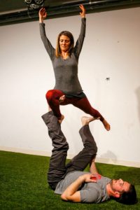 Dorin Ben-Ami of Northampton, top, and Will Witecki of Newington, Conn., perform a straddle throne variation March 31, 2017 during an acroyoga meet up at Mill 180 Park in Easthampton.
