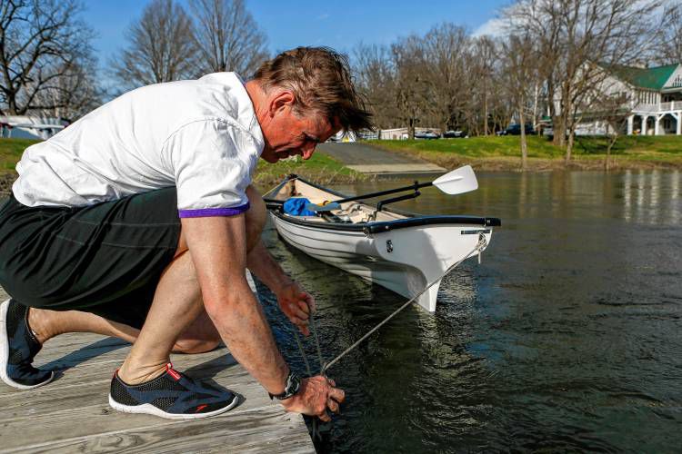 Jim Brassord of Amherst unties his Little River Heritage 18 rowing skiff from the dock April 11, 2017 at the Sportsman's Marina in Hadley. Brassord plans to row from Miami, Fla., to New York City as a fundraising initiative for the John P. Musante Health Center, which will be opening in downtown Amherst in the fall to provide primary medical and dental care to underserved populations, regardless of their ability to pay.