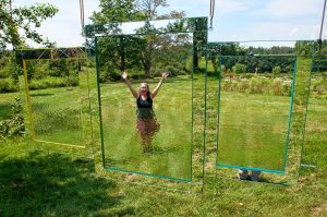 Easthampton artist Eileen Jager installs her piece, Through the Looking Glass at Park Hill Orchard in Easthampton on Wednesday, August 2, 2017, for the biennial Art In the Orchard show which opens Saturday, August 12.