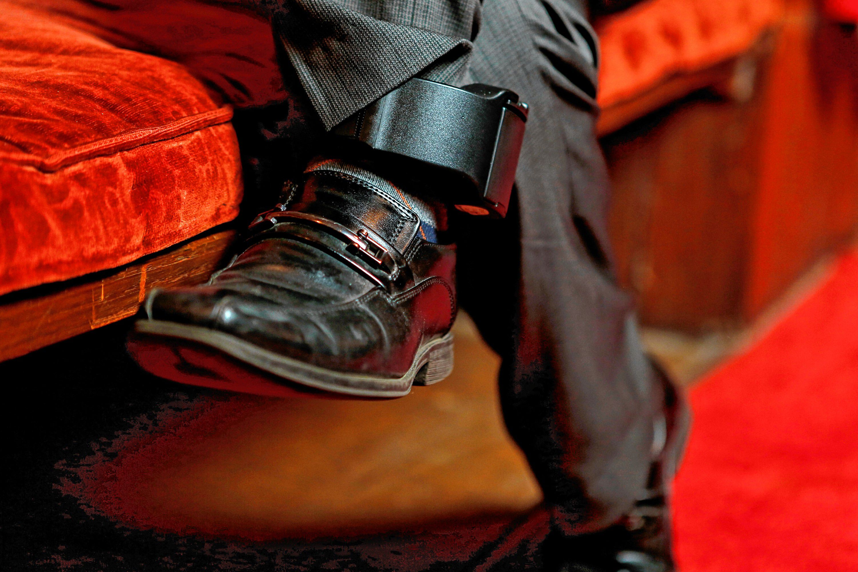 Lucio Perez wears an ankle bracelet put on him by immigration