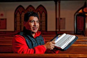 Lucio Perez of Springfield, an undocumented Guatemalan immigrant who is facing deportation, explains Thursday that his faith gives him strength, at the First Congregational Church of Amherst.