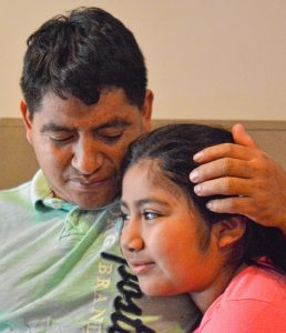 Lucio Perez, of Springfield, who is an undocumented immigrant who was facing deportation until he took refuge at First Congregational Church of Amherst Oct. 18, spends time with his daughter, Lucy, 8, Saturday at the church.