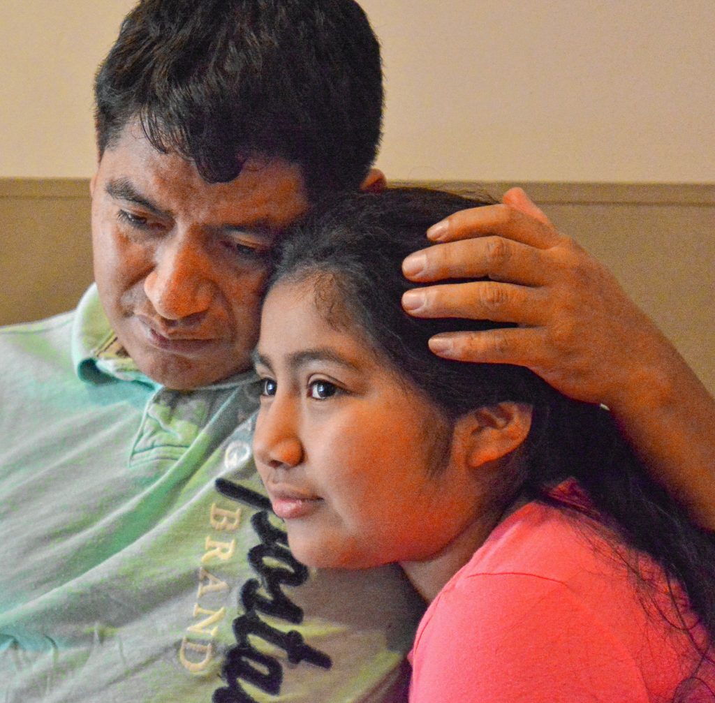 Lucio Perez, of Springfield, who is an undocumented immigrant who was facing deportation until he took refuge at First Congregational Church of Amherst Oct. 18, spends time with his daughter, Lucy, 8, Saturday at the church.