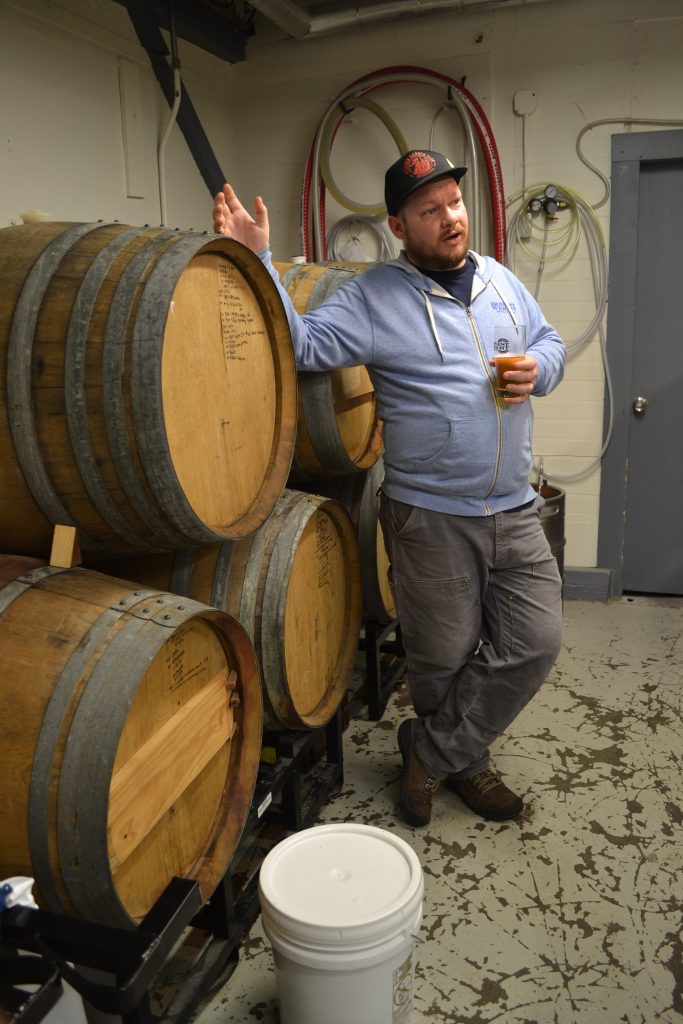 Jay Sullivan, co-owner and brewer at Honest Weight Artisan Beer, gives a tour of the Orange brewery’s 24-barrel cellar. Hunter Styles photo.