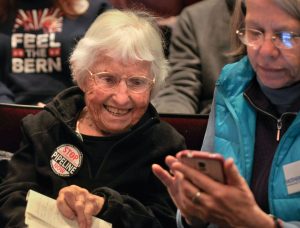 Activist Frances Crowe, left, of Northampton, spends time with a friend, Rachel Wyon, of Cambridge, while waiting to hear presidential candidate Bernie Sanders speak Jan. 4, 2016, at the UMass Fine Arts Center.