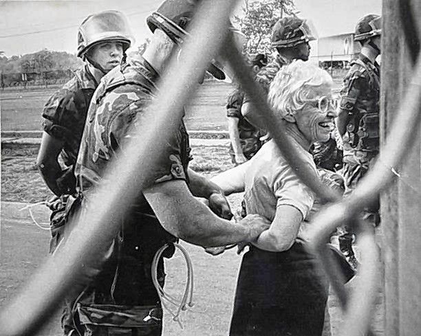 Frances Crowe is arrested for trespassing while protesting nuclear weapons at an air base in 1983.