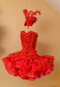 A piece called Fire Bird Ascending inspired by Maria Tallchief,  and made by Marguerite Belkin at her home in Easthampton.  Belkin creates her art work  from paper and  the pieces for the show, called Phenomenal Women, were all inspired by pioneering women who were as Belkin describes them tough or tenacious in their fields. The show will be at Click on Market street in Northampton from Oct 7 2019 to Jan 3 2020.