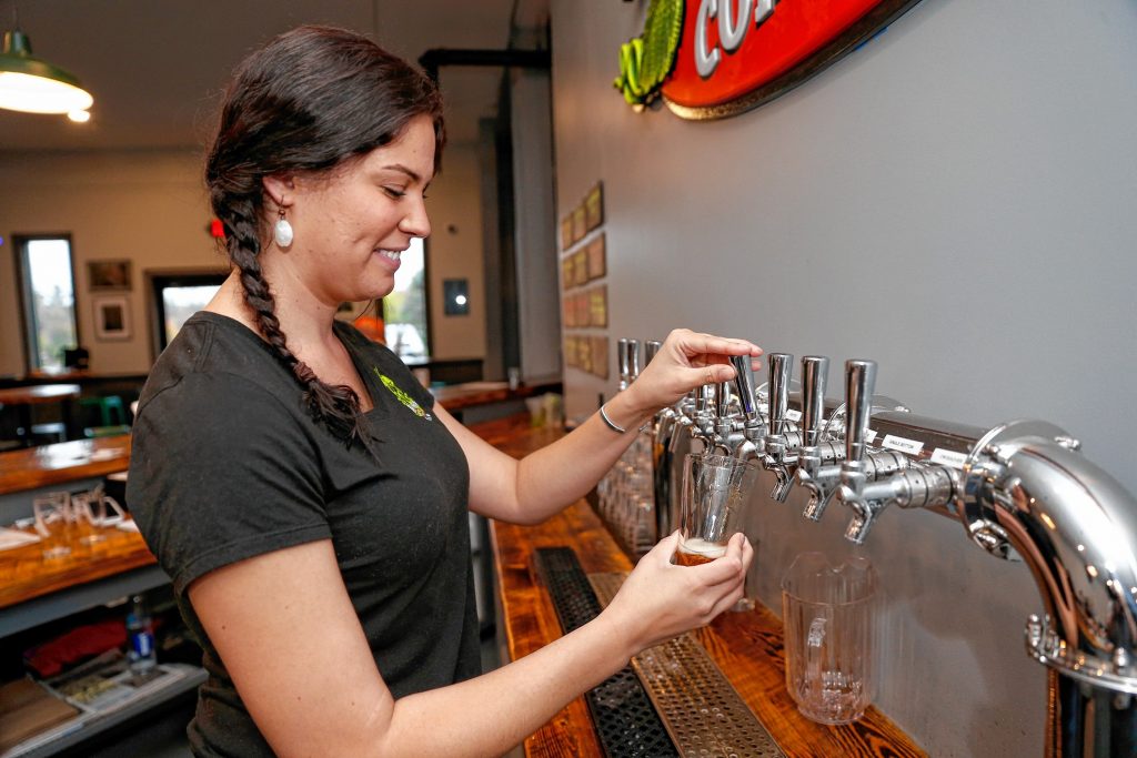 Bartender Erica Hebert pours a pint of Angry Sparrow on Thursday afternoon at the newly opened Hitchcock Brewing Company at 203 South St. in Bernardston.