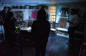 Liette Casey, second from left, with Agawam Paranormal leads an investigation on the ground floor of the 1754 Josiah Day House in West Springfield on Saturday evening, Sept. 14, 2019.