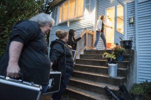 Members of Agawam Paranormal form a bucket brigade to load out a score of equipment cases to take to the Josiah Day House in West Springfield for an investigation on Saturday evening, Sept. 14, 2019. From left are Cindy Hall of Easthampton, Joy Holhut of Conway, Christine Piquette of South Hadley and Pam Raymond of East Longmeadow.