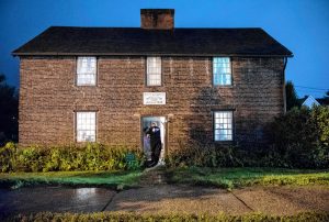 Agawam Paranormal senior investigator Richard LaBombard of Belchertown enters the 1754 Josiah Day House in West Springfield for an investigation on Saturday evening, Sept. 14, 2019.