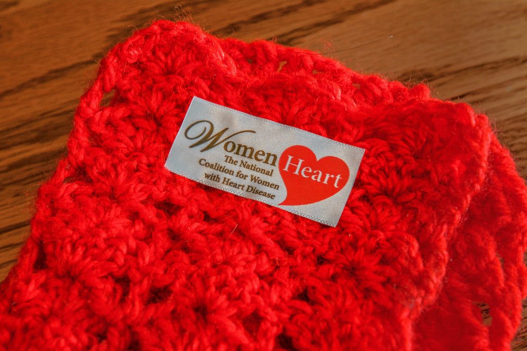 A scarf crocheted by Lynette Bloise for WomenHeart rests on a table at her home in Pelham, Thursday, Oct. 31, 2019.