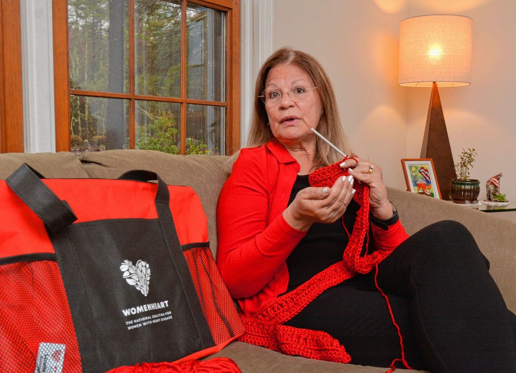 Lynette Bloise, who has become a WomenHeart champion, crochets a scarf as she talks about her work with the group, Thursday, Oct. 31, 2019 at her home in Pelham.