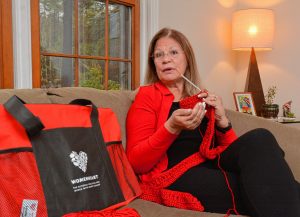 Lynette Bloise, who has become a WomenHeart champion, crochets a scarf as she talks about her work with the group, Thursday, Oct. 31, 2019 at her home in Pelham.