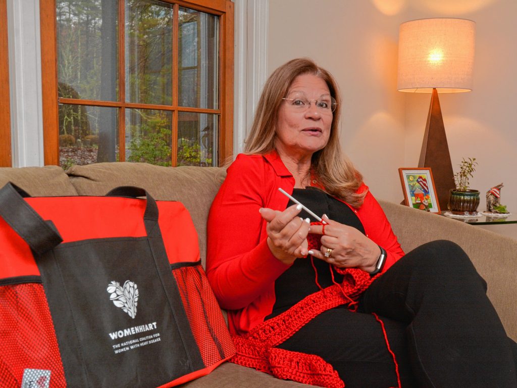 Lynette Bloise, who has become a WomenHeart champion, crochets a scarf as she talks about her work with the group, Thursday, Oct. 31, 2019 at her home in Pelham.