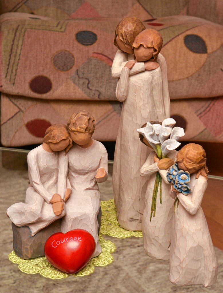 Willow Tree sculptures rest on a coffee table at the home of Lynette Bloise. She collects the sculptures.