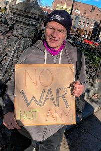 Dave Madeloni with his “No War / Not Any!” sign.