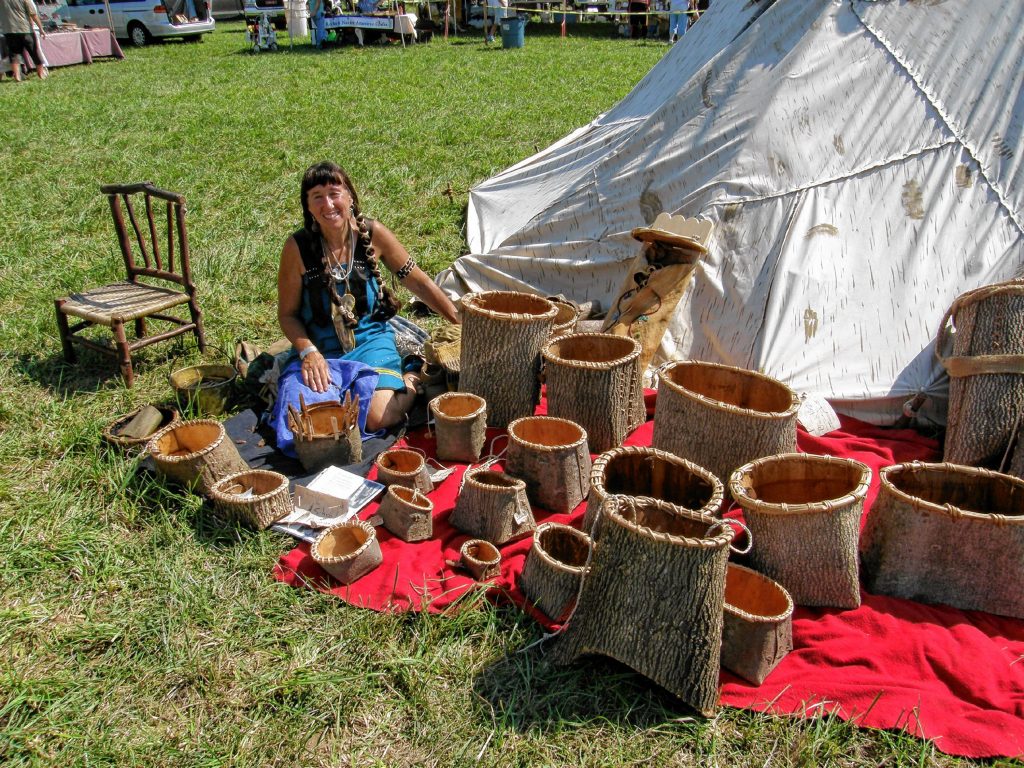 Jennifer Lee at a past Pocumtuck Homelands Festival in Turners Falls with some of the baskets she makes. “A lot of native culture has been lost, but a lot has survived,” she says.