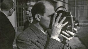 Bolex inventor Jacques Bolsey holds his invention.