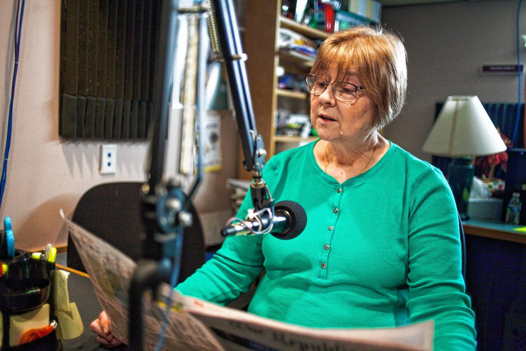 Volunteer Jeanne DelMonte reads from the Springfield Republican in Valley Eye Radio’s Springfield studios Friday afternoon.