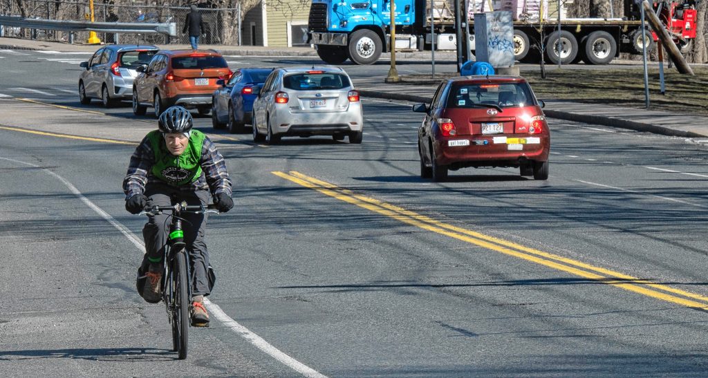 Salem Mazzawy, of Granby, seen here biking through Northampton, says “I’m far more comfortable on a bike. It just doesn’t make a lot of sense for me to have a car right now.”