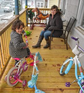 Sadie Cora, who is a third grade teacher in Northampton, with her daughter, Alice, 5, at their home in Holyoke, Monday, Mar. 23, 2020.