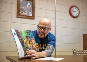 Luis Soria is the principal of Dr. Marcella R. Kelly School in Holyoke. Each day since schools have closed he posts a video of himself reading a book aloud. On Wednesday, March 25, 2020, he and assistant principal Michelle Hernandez blocked out how they'll tape him reading "Chato's Kitchen" by Gary Soto and Susan Guevara.
