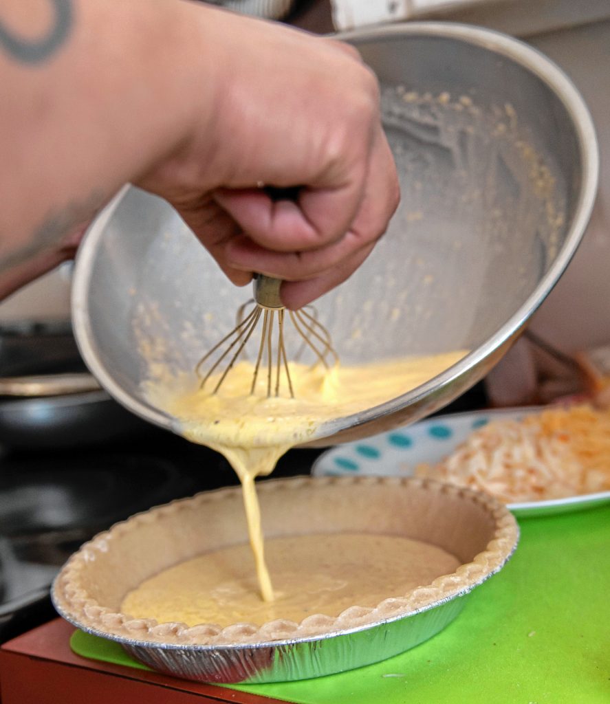 Chrissy Rivera, of Springfield, makes a quiche using a  butter mixture she made containing THC.