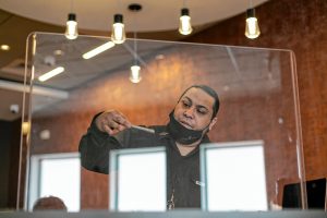Steven Robles, team leader and joint specialist at Turning Leaf Centers in Northampton, shakes a freshly rolled joint to pack down its contents and ensure an even smoke. Robles was leading a joint-rolling demonstration on April 18.