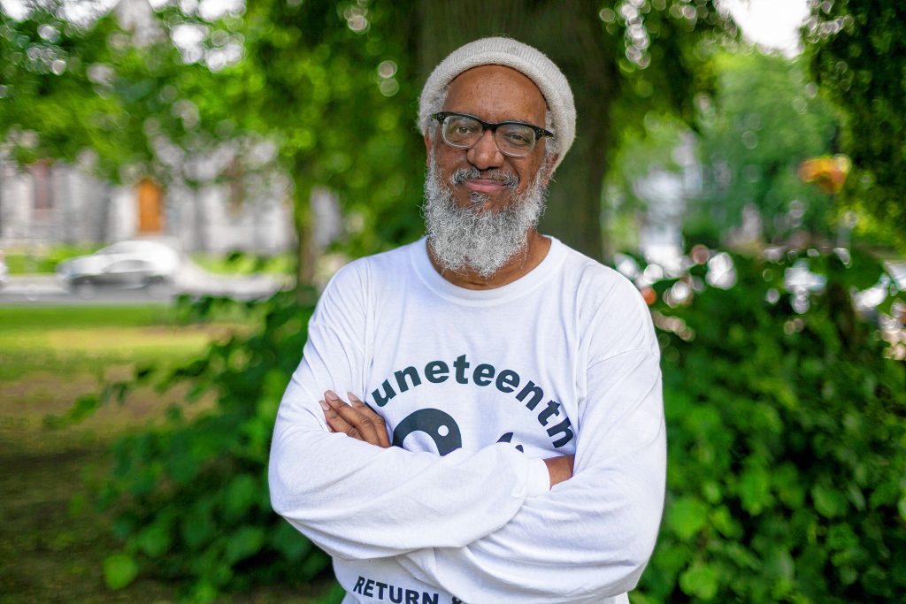 Dr. Amilcar Shabazz, Professor at the W.E.B. DuBois Department of African American Studies at UMASS Amherst, stands outside a Juneteenth Community Jubilee Celebration in the town common, Saturday in Amherst, MA.
