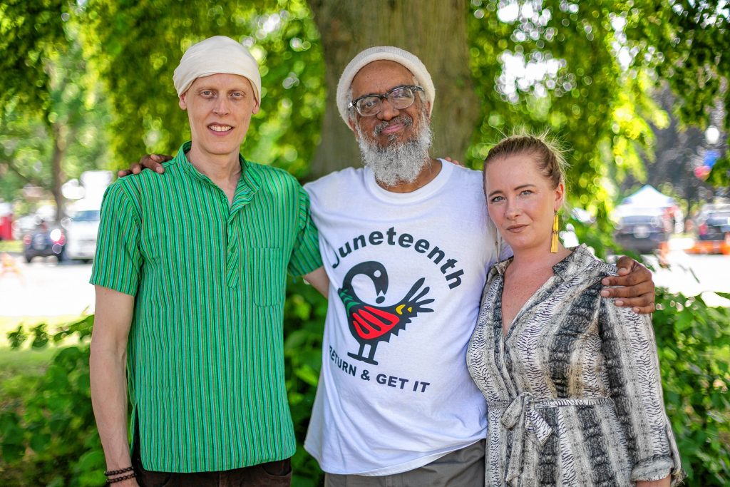 Reparations for Amherst (R4A) Founders Matthew Andrews and Michele Miller stand with Dr. Amilcar Shabazz, Professor at the W.E.B. DuBois Department of African American Studies at UMASS Amherst, outside a Juneteenth Community Jubilee Celebration in the town common, Saturday in Amherst, MA.