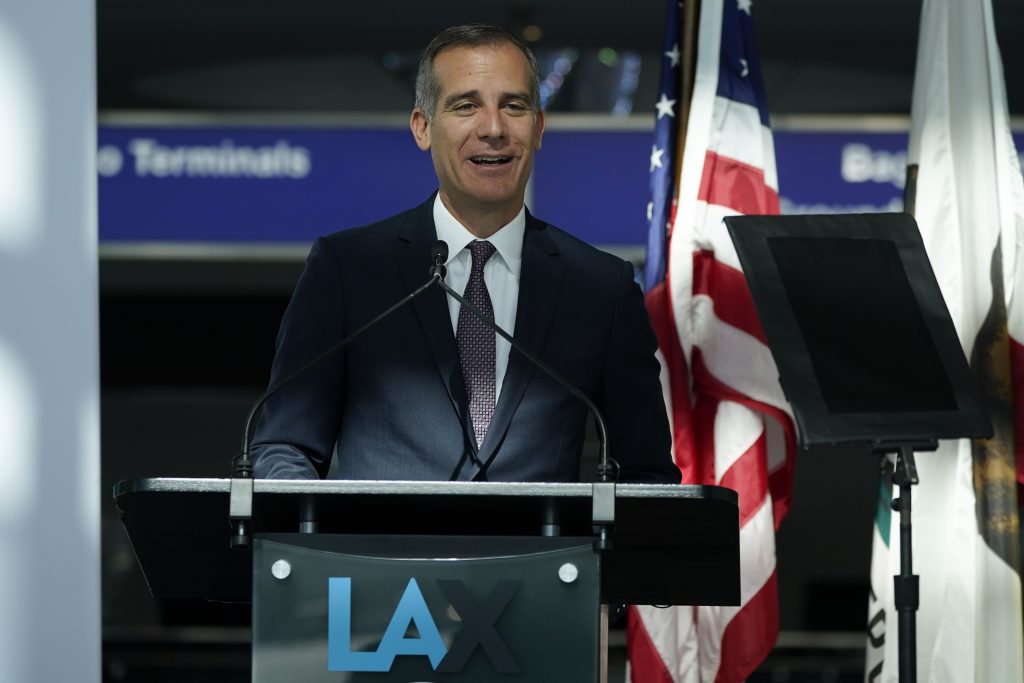 FILE - In this May 24, 2021 file photo Los Angeles Mayor Eric Garcetti speaks a press conference at Los Angeles International Airport, in Los Angeles. A group of 11 U.S. mayors have pledged to pay reparations for slavery to a small group of Black residents in their cities. The mayors have committed to form commissions to advise them on how to develop the programs. (AP Photo/Ashley Landis, File)