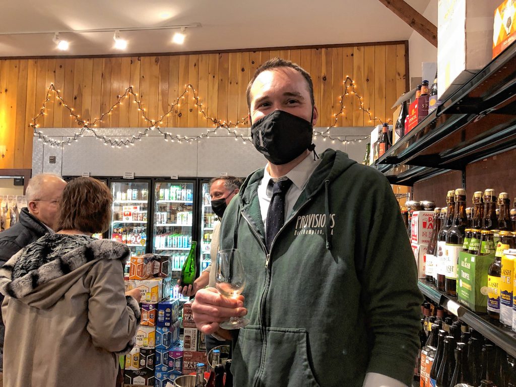 Provisions owner  Benson at the Grand Champagne Tasting Dec. 11, which  celebrated the opening of their   new store in North Amherst.